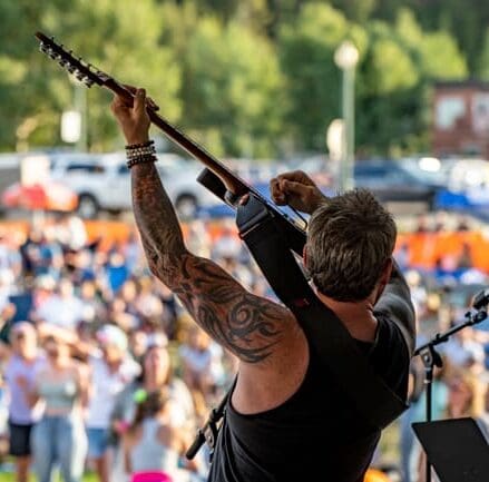 guitar player performing on stage