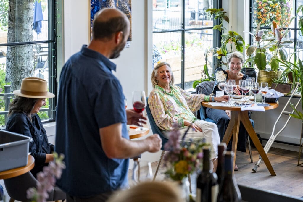 A person teaching a wine seminar