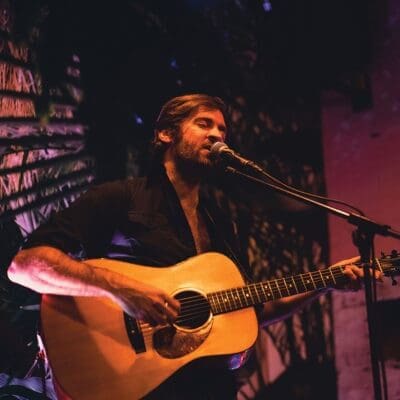 John Craigie plays the guitar